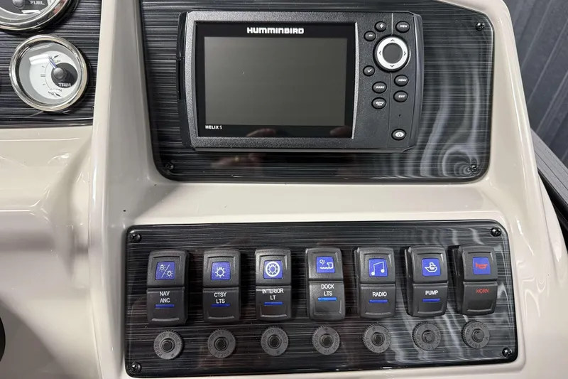 Slide: The Image of Dashboard of 2026 Sylvan Mirage X1 with Humminbird Helix 5 and control switches. - 10