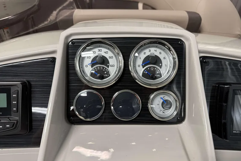 Slide: The Image of Dashboard of 2026 Sylvan Mirage X1 boat with gauges and controls. - 11