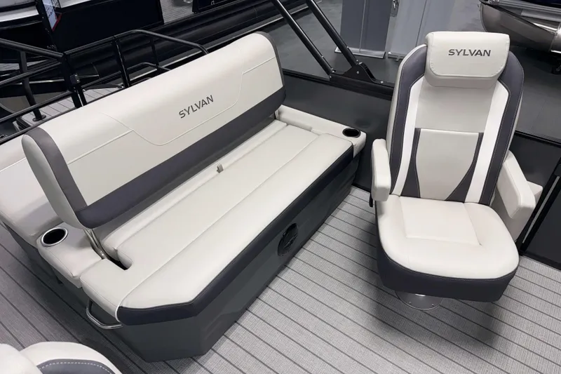 Slide: The Image of 2026 Sylvan Mirage X1 boat interior with white and gray seating. - 14