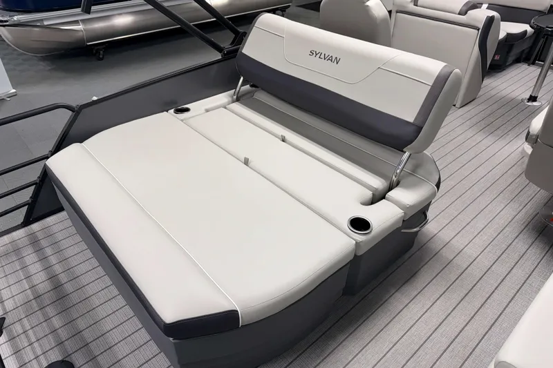 Slide: The Image of 2026 Sylvan Mirage X1 boat interior with comfortable seating and cup holders. - 15