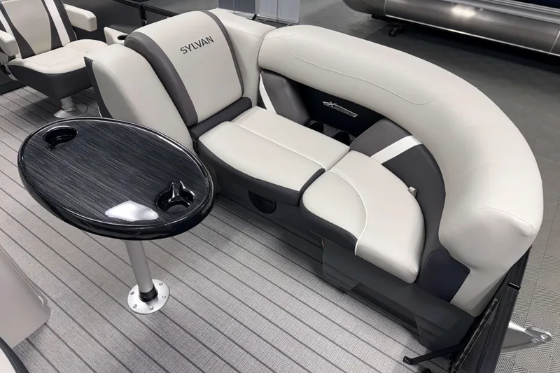 Slide: The Image of Luxurious seating in 2026 Sylvan Mirage X1 boat with sleek table and cup holders. - 3