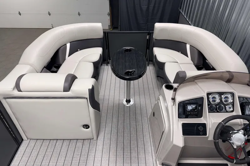 Slide: The Image of 2026 Sylvan Mirage X1 boat interior with plush seating and modern dashboard. - 4