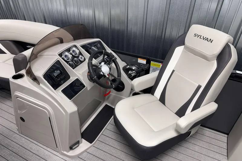Slide: The Image of 2026 Sylvan Mirage X1 boat cockpit with modern steering and comfortable seating. - 7
