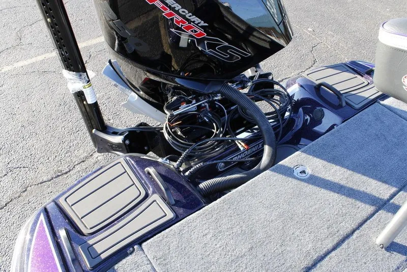 Slide: The Image of 2026 Phoenix 21 boat with Mercury Pro XS engine, detailed view of deck and motor area. - 21