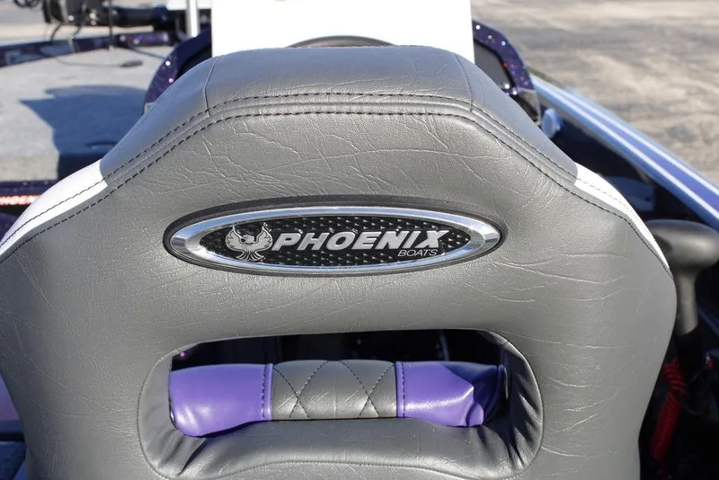 Slide: The Image of 2026 Phoenix 21 boat seat with logo, featuring gray and purple upholstery. - 24