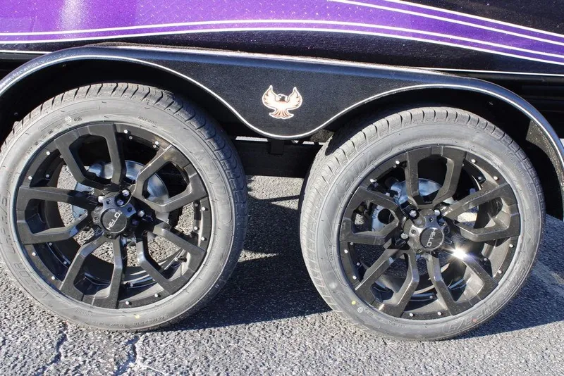 Slide: The Image of 2026 Phoenix 21 model with black alloy wheels and purple detailing. - 26