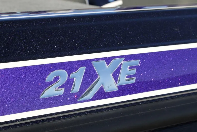 Slide: The Image of Close-up of 2026 Phoenix 21 model with "21 XE" emblem on purple background. - 4