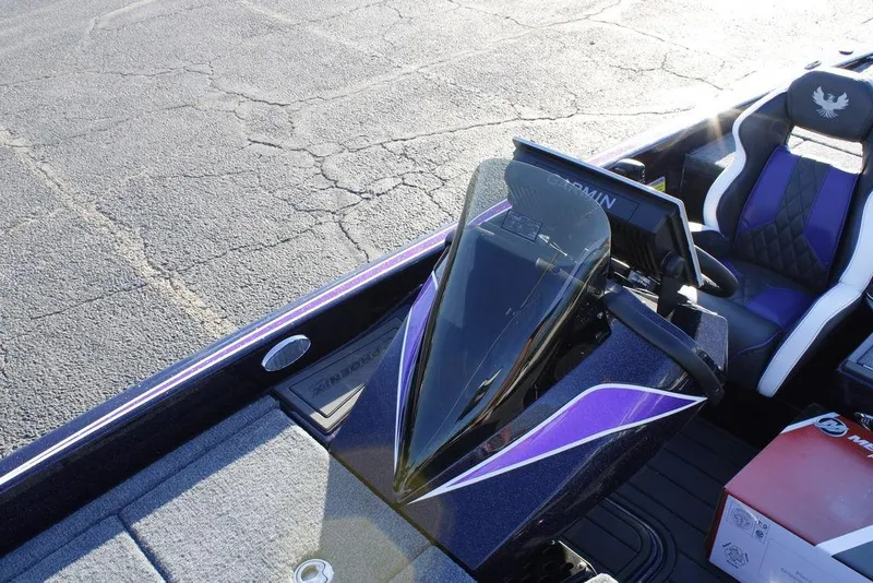 Slide: The Image of 2026 Phoenix 21 boat interior with Garmin display and purple-accented seats. - 6