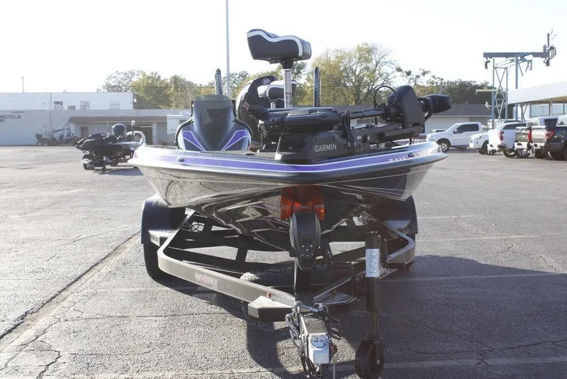 Slide: The Image of 2026 Phoenix 21 boat with Garmin equipment on a trailer in a parking lot. - 7