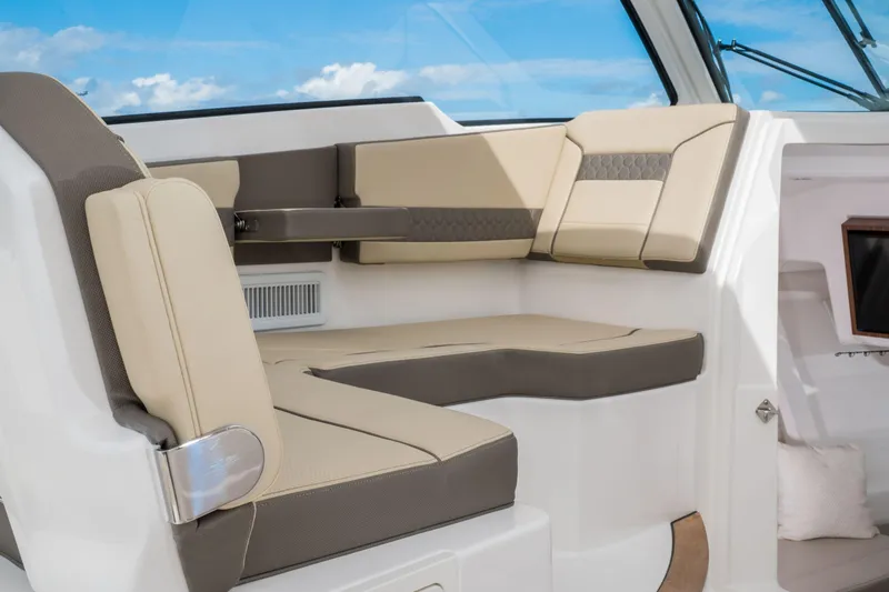 Slide: The Image of 2026 Pursuit DC 365 Dual Console interior with luxurious seating and modern dashboard. - 14