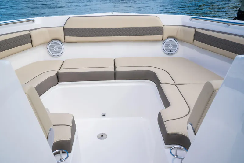 Slide: The Image of 2026 Pursuit DC 365 Dual Console interior with white seating and modern design. - 18