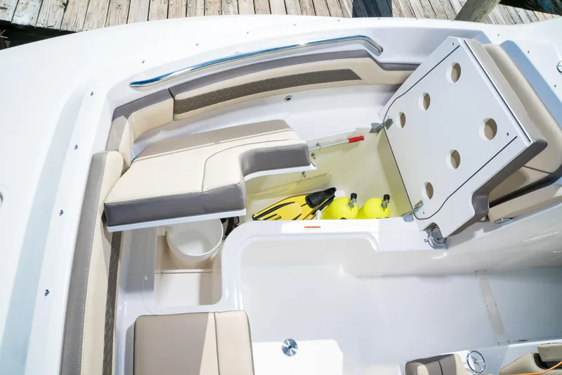 Slide: The Image of Luxurious interior of 2026 Pursuit DC 365 Dual Console boat with seating and TV. - 19