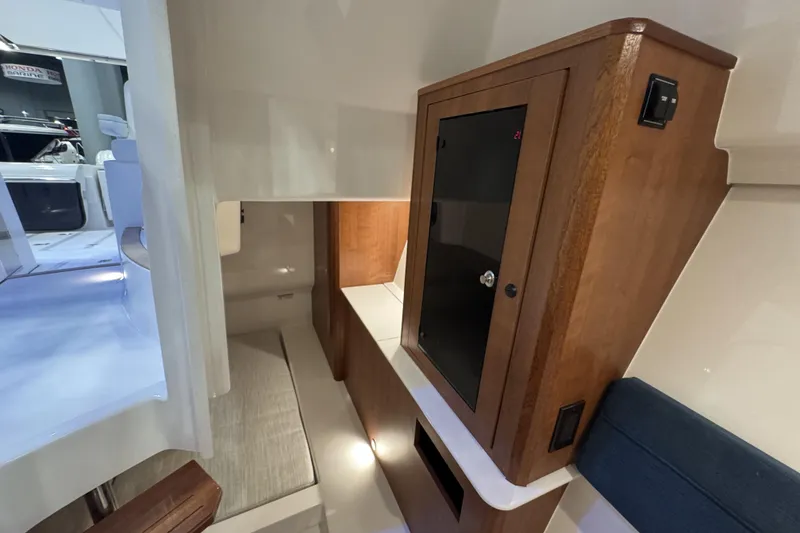 Slide: The Image of Interior of 2026 Pursuit DC 365 Dual Console, featuring sleek cabinetry and modern design elements. - 20