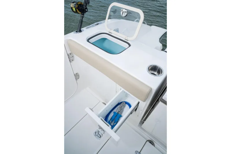 Slide: The Image of 2026 Pursuit DC 365 Dual Console boat interior at a boat show display. - 6