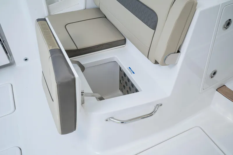 Slide: The Image of 2026 Pursuit DC 365 Dual Console boat interior at a boat show. - 9