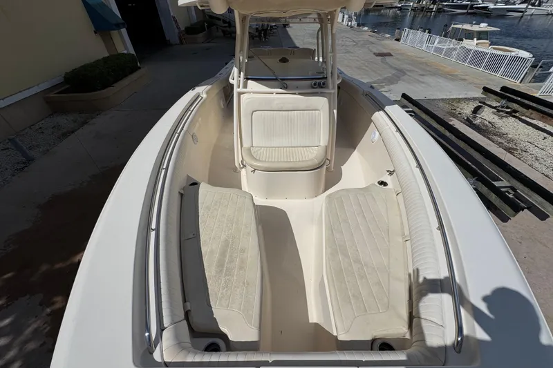 Slide: The Image of 2014 Grady-White Canyon 336 boat interior with seating, docked at marina. - 19
