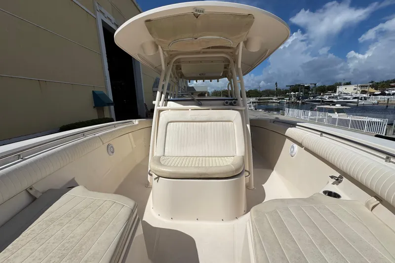 Slide: The Image of 2014 Grady-White Canyon 336 boat interior with seating, docked at marina. - 22