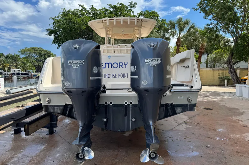 Slide: The Image of 2014 Grady-White Canyon 336 boat with twin Yamaha 350 engines, docked outdoors. - 7