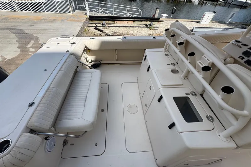 Slide: The Image of 2014 Grady-White Canyon 336 boat interior with seating and storage compartments. - 9
