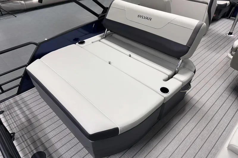 Slide: The Image of 2026 Sylvan MIRAGE X1 CLZ DH boat interior with sleek seating and cup holders. - 13