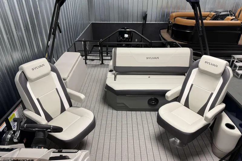 Slide: The Image of 2026 Sylvan MIRAGE X1 CLZ DH boat interior with modern seating and steering. - 5