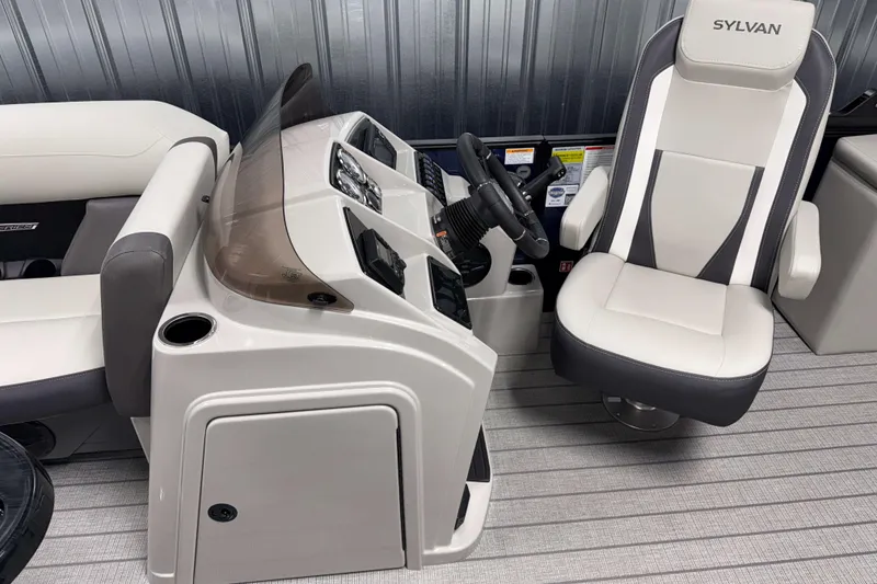Slide: The Image of 2026 Sylvan MIRAGE X1 CLZ DH boat interior with modern helm and comfortable seating. - 6