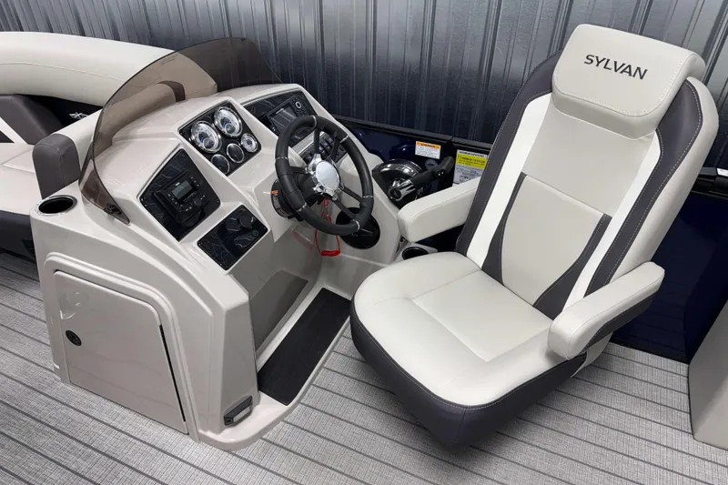 Slide: The Image of 2026 Sylvan MIRAGE X1 CLZ DH boat interior with steering console and captain's chair. - 7