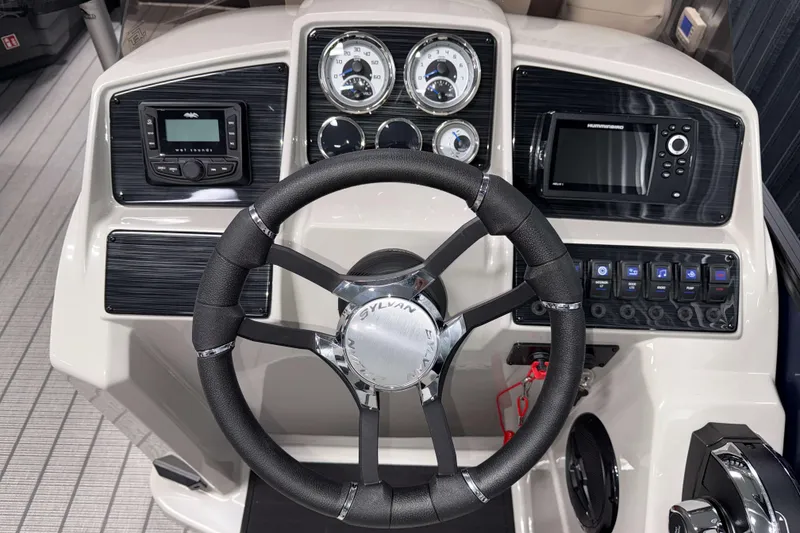 Slide: The Image of Steering console of 2026 Sylvan MIRAGE X1 CLZ DH boat with modern controls and displays. - 9