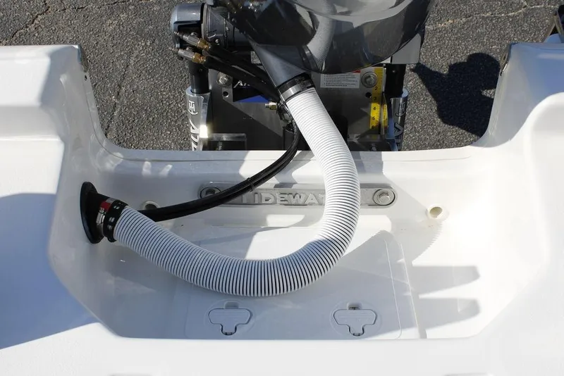 Slide: The Image of 2026 Tidewater 2110 Bay Max boat engine area with hose and fittings. - 14