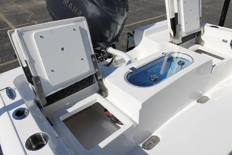 Slide: The Image of 2026 Tidewater 2110 Bay Max boat interior with storage compartments and Yamaha engine. - 15