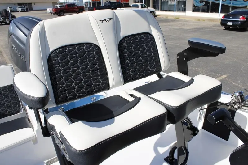 Slide: The Image of 2026 Tidewater 2110 Bay Max boat seats with black and white upholstery, featuring armrests. - 21