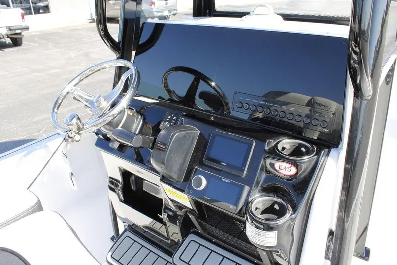 Slide: The Image of 2026 Tidewater 2110 Bay Max boat console with steering wheel and control panel. - 22