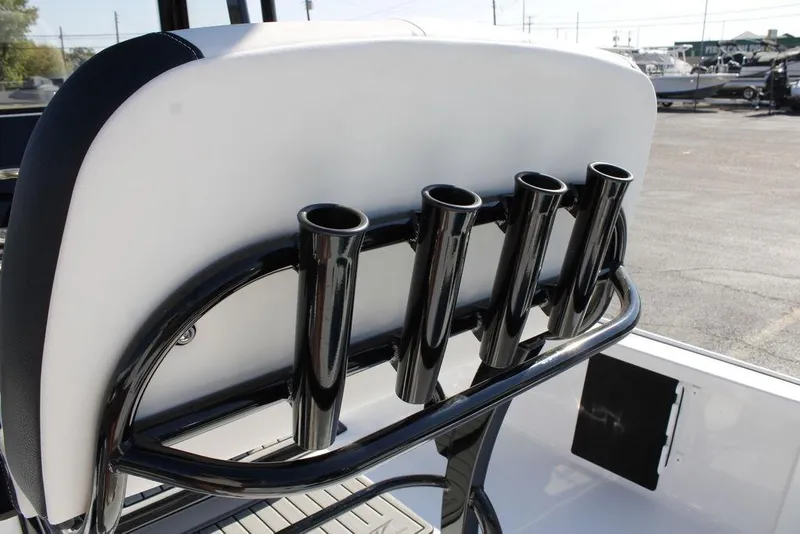 Slide: The Image of 2026 Tidewater 2110 Bay Max boat with rod holders on seat back. - 29