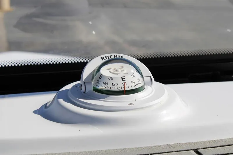 Slide: The Image of Compass on 2026 Tidewater 2110 Bay Max boat dashboard, showing east direction. - 33