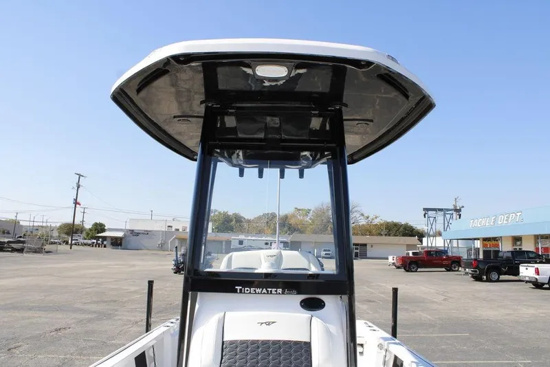 Slide: The Image of 2026 Tidewater 2110 Bay Max boat with T-top in a parking lot. - 36