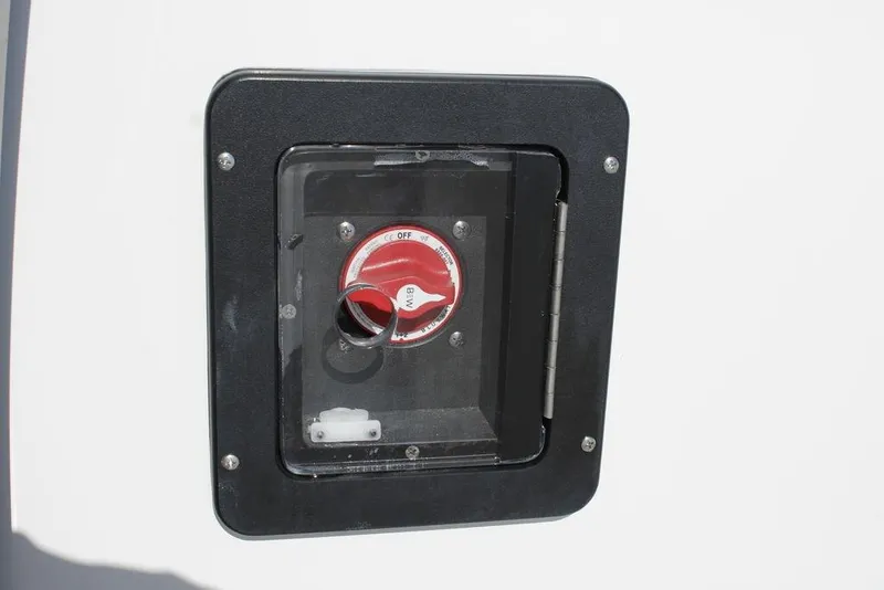 Slide: The Image of 2026 Tidewater 2110 Bay Max boat battery switch in a black enclosure. - 41