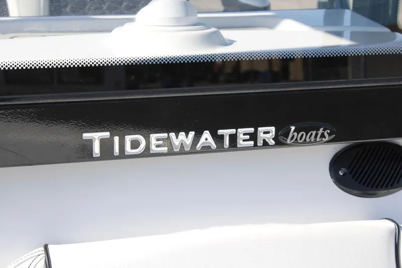 Slide: The Image of Tidewater 2110 Bay Max 2026 boat logo on black and white surface. - 42