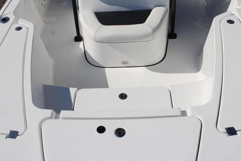 Slide: The Image of 2026 Tidewater 2110 Bay Max boat interior with seating and storage compartments. - 43