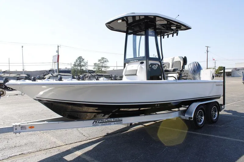 Slide: The Image of 2026 Tidewater 2110 Bay Max boat on trailer in parking lot. - 7
