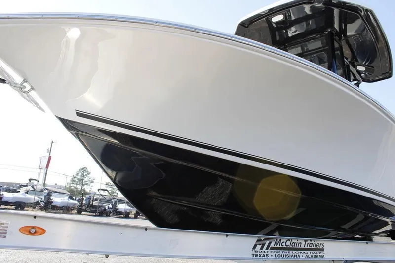 Slide: The Image of 2026 Tidewater 2110 Bay Max boat on McClain trailer, side view. - 9