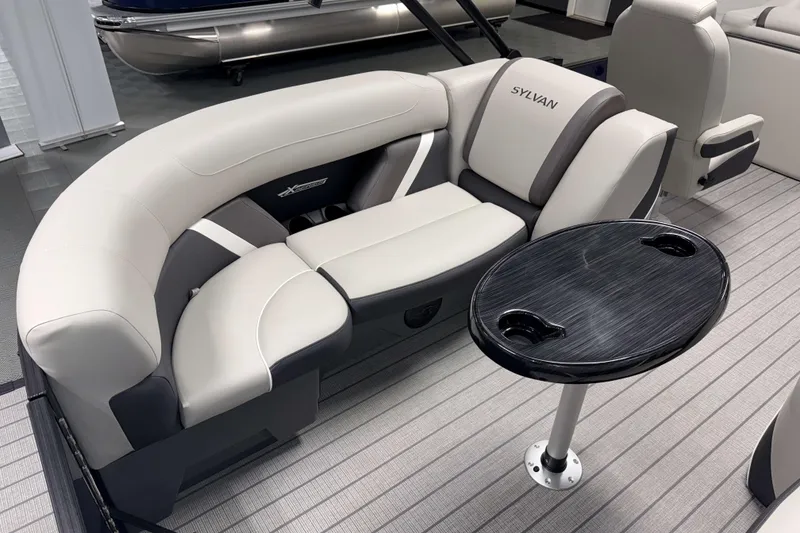 Slide: The Image of Luxurious seating on 2026 Sylvan Mirage X3 pontoon boat with sleek table design. - 16