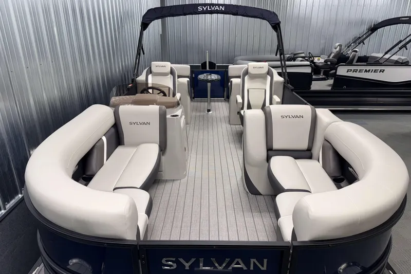 Slide: The Image of 2026 Sylvan Mirage X3 pontoon boat with luxurious seating and sleek design. - 4