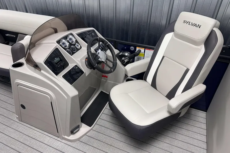 Slide: The Image of 2026 Sylvan Mirage X3 boat interior with modern helm and comfortable captain's chair. - 8