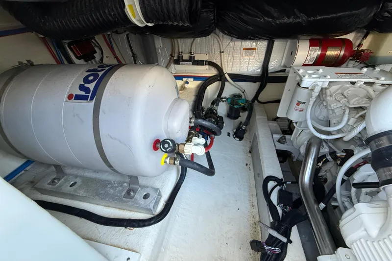 Slide: The Image of Engine room of 2019 Back Cove Downeast 37 with Isotemp water heater and mechanical components. - 16