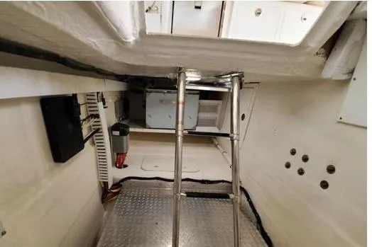 Slide: The Image of Engine room of 2019 Back Cove Downeast 37 with ladder and equipment. - 8