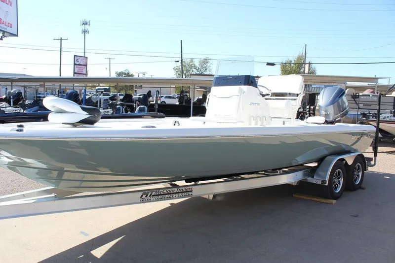 Slide: The Image of 2026 Skeeter SX241 boat on trailer in outdoor dealership lot. - 14