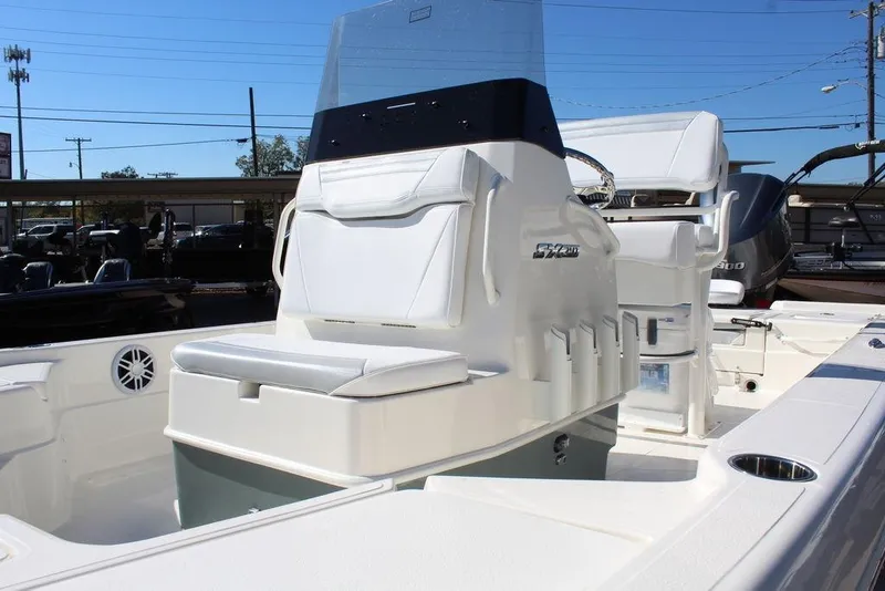 Slide: The Image of 2026 Skeeter SX241 boat interior with seating and console, showcasing modern design and functionality. - 15