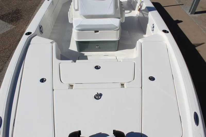 Slide: The Image of 2026 Skeeter SX241 boat interior with white seating and storage compartments. - 21