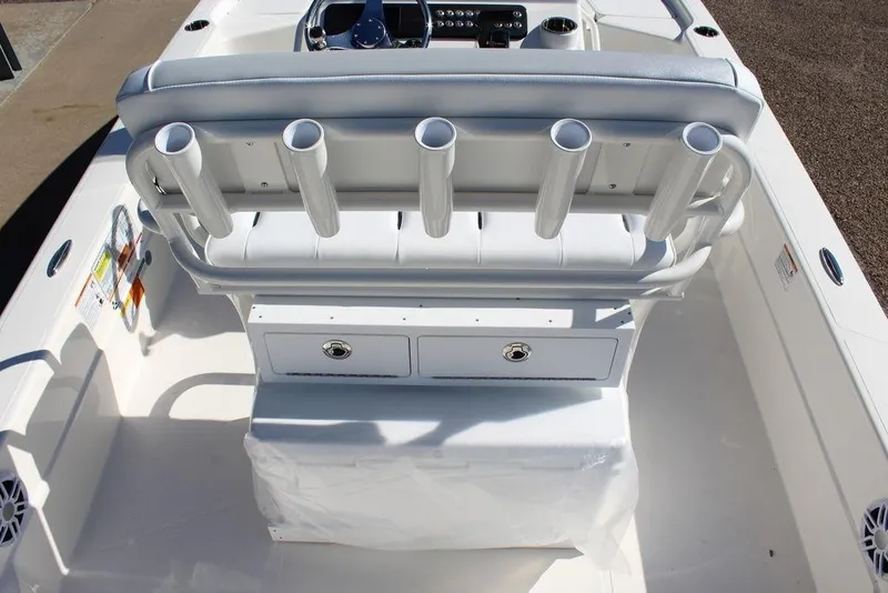 Slide: The Image of 2026 Skeeter SX241 boat interior with rod holders and storage compartments. - 9