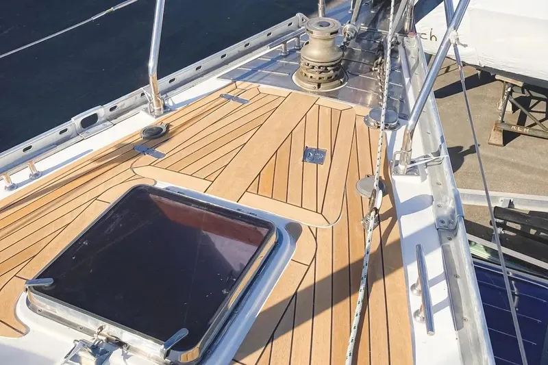 Slide: The Image of Deck of a 1999 Hylas 54 yacht with teak finish and winch. - 3